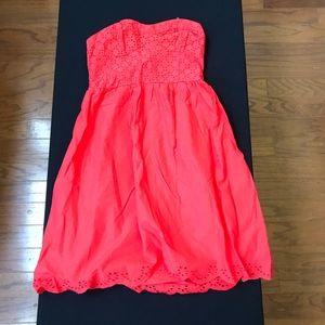 Red sleeveless dress.